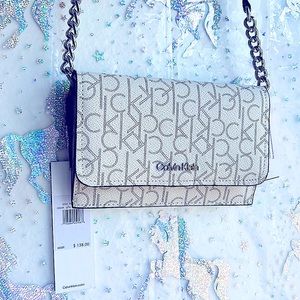 Very sleek beautiful brand new handbag cross body great for phone card lipsticks